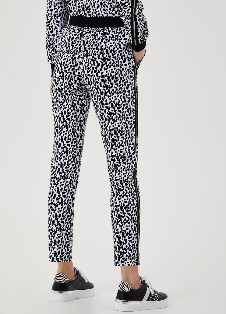 Animal print trousers with appliqués