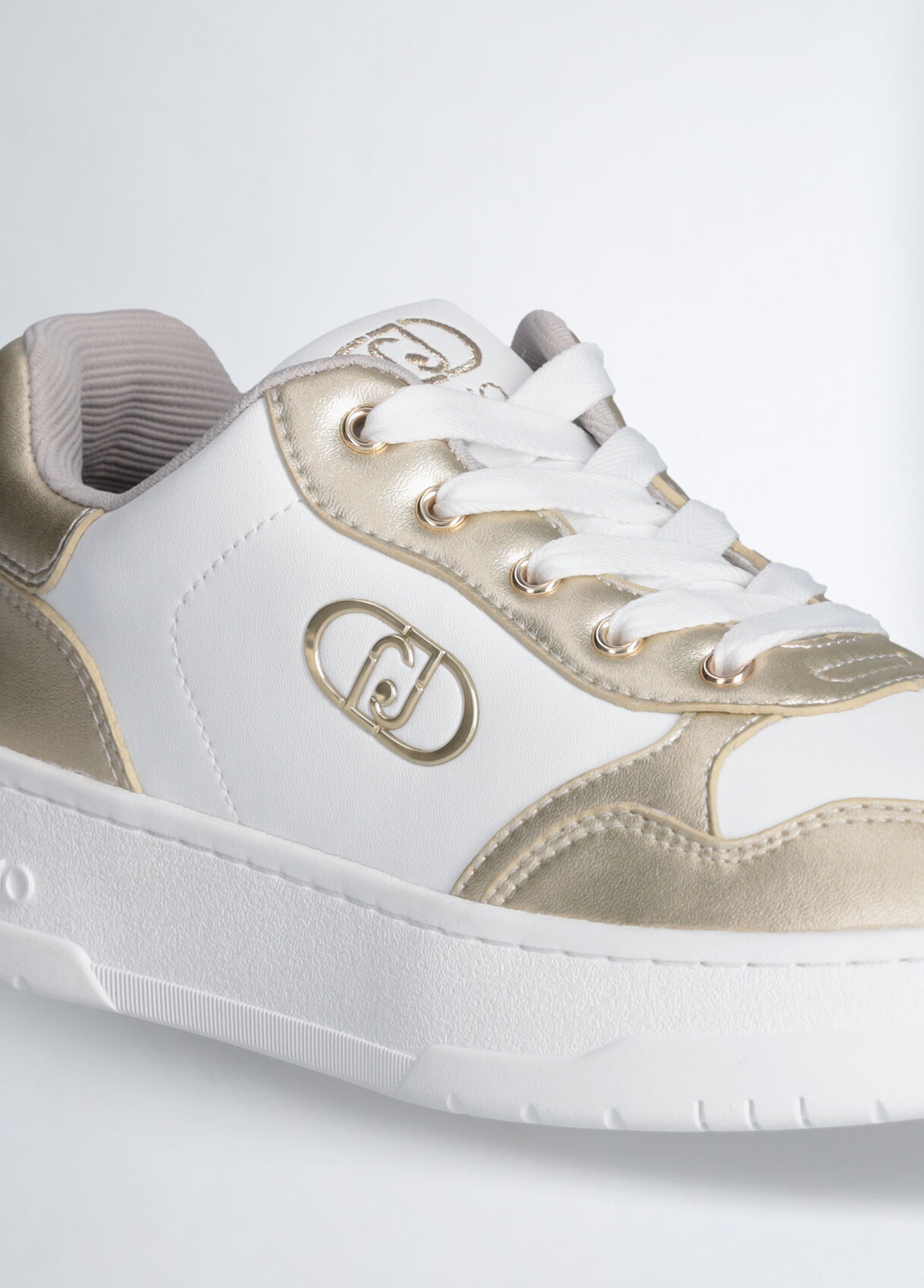 white sneakers gold numbers