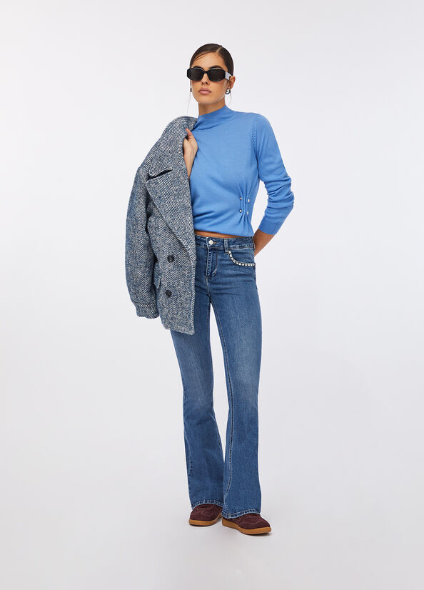 Baby blue mock neck sweater with flare jeans