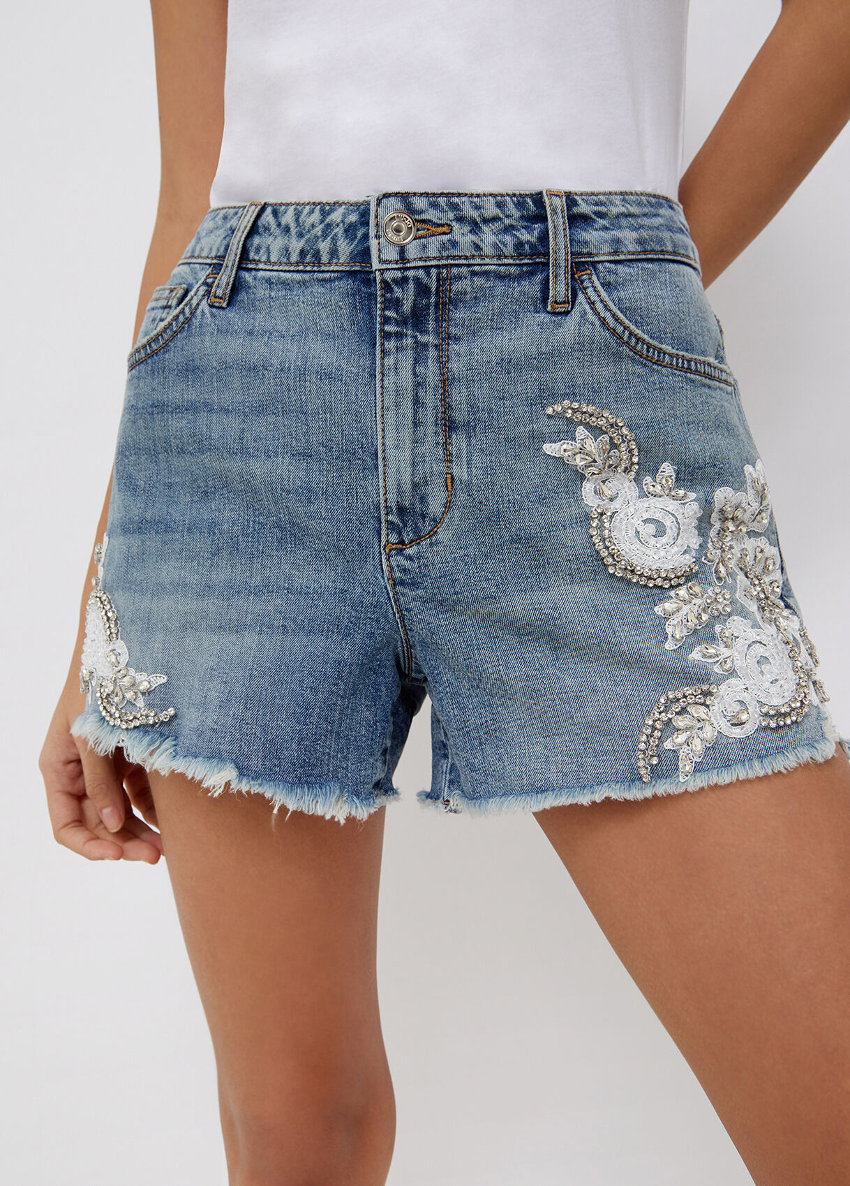 Denim shorts with embroidered jewels